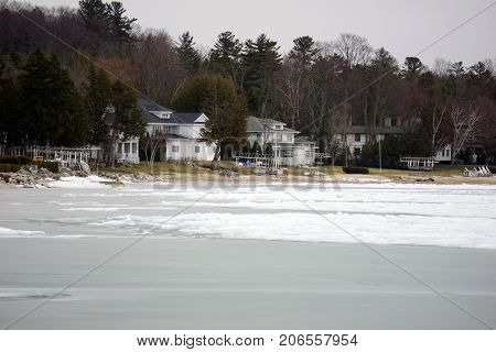 A view of lakefront homes on Beach Drive in Wequetonsing, Michigan, during March.