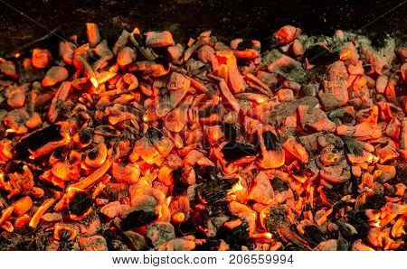 background of burning coals . Photo of an abstract texture
