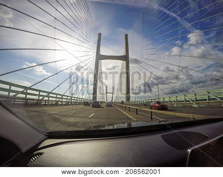 Chepstow, UK: July 31, 2016: Crossing the Severn Bridge westward bound. Through the windscreen shot with a gopro