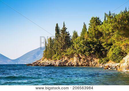 Beautiful views of the sea shore - the sea rocks forests and mountains. Greek islands in Ionian sea.