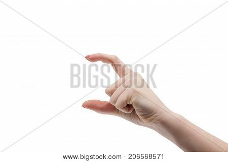 Small size gesture. Female hand is pointing at small item. Human hand in picking gesture isolate on white background. Size of male penis or other product. Advertising gesture for product display space