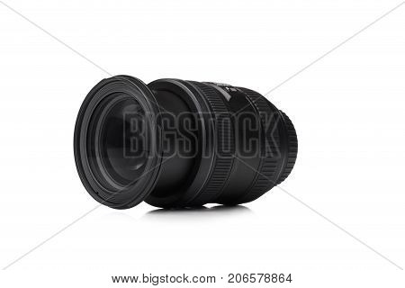 A close-up picture of a black zoom lens isolated on a white background. A professional instrument for taking qualitative photographies. Electronic equipment for photographers. Technology concept.
