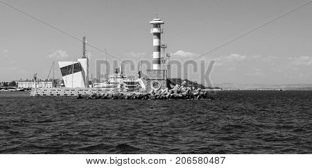 BURGAS BULGARIA - AUGUST 20 2017: Lighthouse control tower of the seaport of Burgas. Black and white. Burgas is the second largest city on the Bulgarian Black Sea Coast.