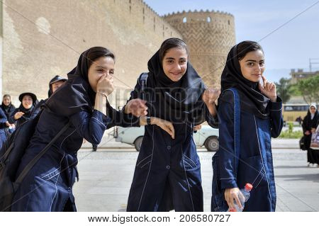 Fars Province Shiraz Iran - 19 april 2017: Three iranian schoolgirls having fun near Karim Khan citadel editorial use only.