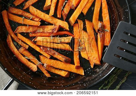 Frying pan with sweet potato fries, close up