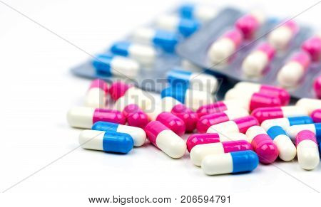 Colorful of antibiotic capsules pills selective focus on blur background with copy space. Drug resistance antibiotic drug use with reasonable health policy and health insurance concept.