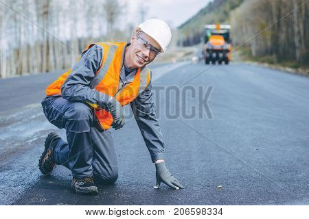 road worker construction repair asphalt highway build