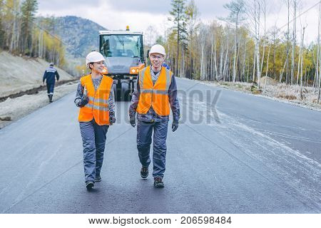 roller road repair work pavement ashalt happy