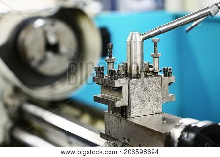 Lathe machine in a workshop and garage. Lathe machine is operation on the workshop by technician or operator. the machine for modify the object or spare part in industry job.