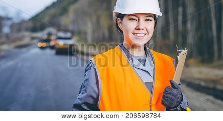 female worker road construction infrastructure repair pavement