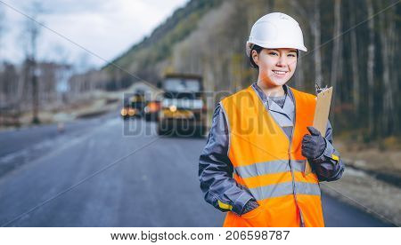 female worker road construction infrastructure repair pavement