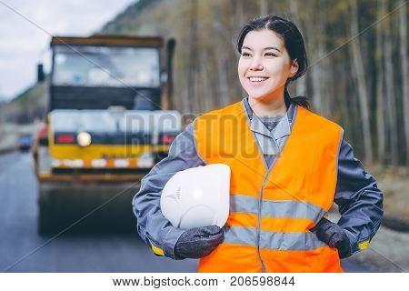 female worker road construction infrastructure repair pavement