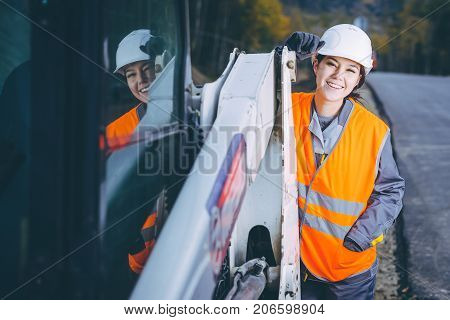 female worker road construction infrastructure repair pavement