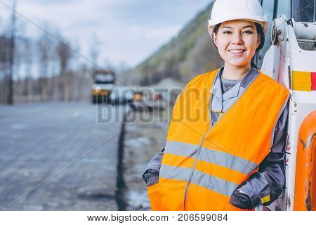 female worker road construction infrastructure repair pavement