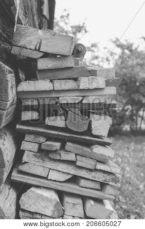 Monochrome photo of the fire wood in the village