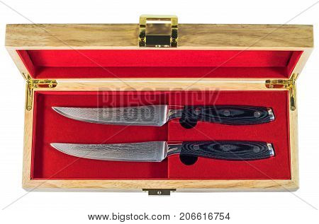 Steak knife set in a wooden box isolated on white background