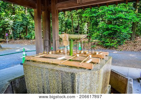 TOKYO, JAPAN - MAY 15: Original Japanese dipper water blessing and pray for good health and happiness located in Meiji Shrine, Shibuya, Tokyo