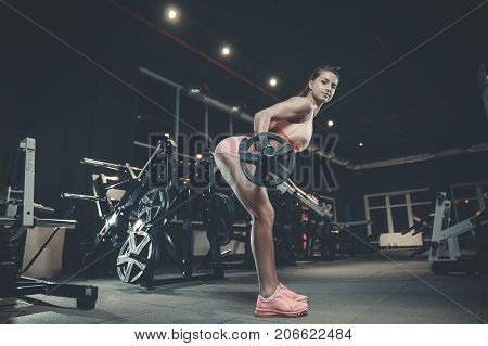 Sexy Athletic Young Girl Training Back In Gym