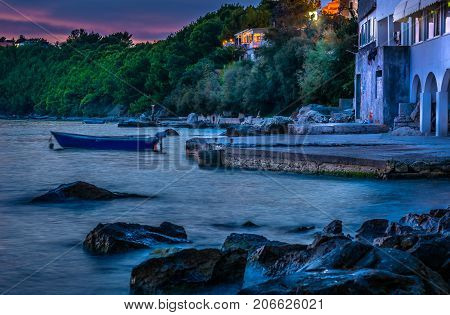 Sunset view at marble colorful coastline in suburb of town Split, Croatia.