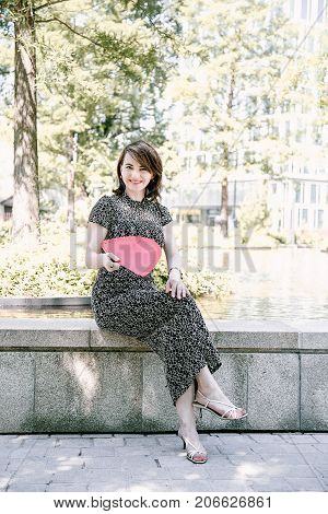 A Young Girl Walks In An Old Park.