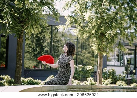 A Young Girl Walks In An Old Park.