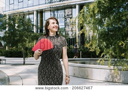A Young Girl Walks In An Old Park.