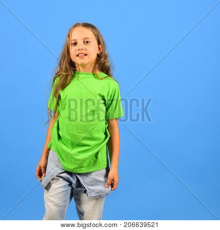 Girl With Happy Face On Blue Background. Childhood And Lifestyle
