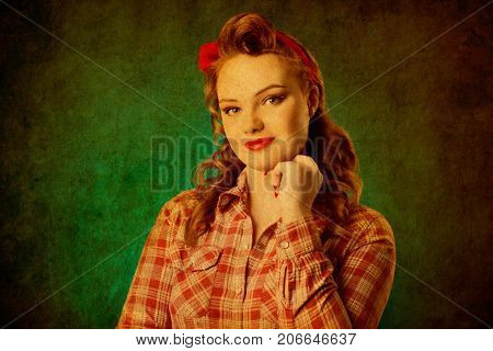 Closeup young pretty pinup girl red button shirt looking at you camera teal color background retro vintage 50's style. Human emotions body language