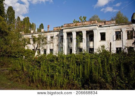 Abandoned and overgrown ruins of school named after Beria. Abkhazia, Georgia