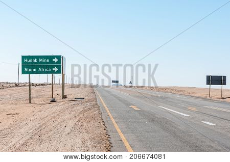 ARANDIS NAMIBIA - JULY 3 2017: The turn-off to the Husab Mine and Stone Africa from the B2-road between Swakopmund and Arandis in the Namib Desert of Namibia