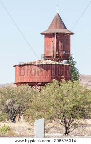 USAKOS NAMIBIA - JULY 3 2017: Rusted water reservoirs from the steam train era in Usakos in the Erongo Region of Namibia