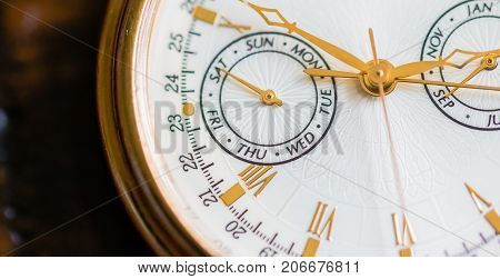 A Macro view of a gold watch.