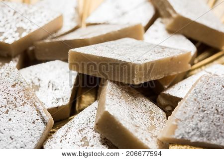 Stock photo of Kaju Katli, a popular indian sweet burfi made using milk, khoya, cachew and Sugar