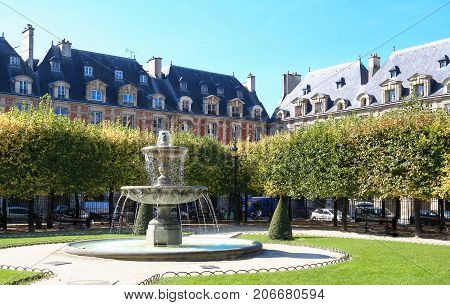 The famous place des Vosges , major landmark in Paris, located in Marais district.