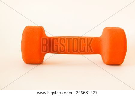 little orange dumbbell for sports and fitness