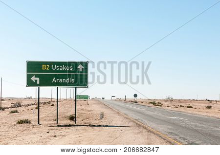 ARANDIS NAMIBIA - JULY 3 2017: The turn-off to Arandis and the Rossing Uranium Mine from the B2-road between Swakopmund and Usakos in the Namib Desert of Namibia