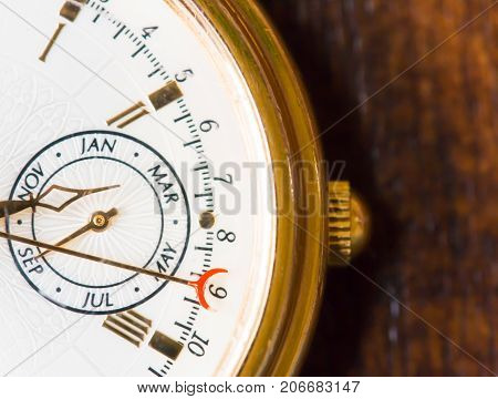 A Macro view of a gold watch.
