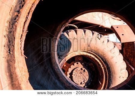 huge dirty old car wheels kind of inside