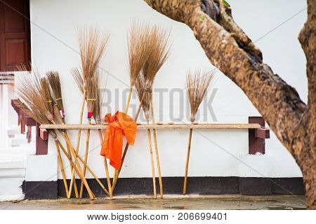 Brooms In The Courtyard Of The Temple Wat Sensoukaram In Louangphabang, Laos. Close-up.