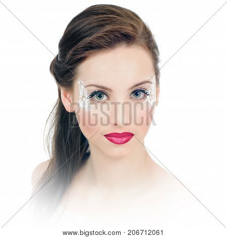 Glamour portrait of beautiful woman with bright makeup and faceart. with white vignetting