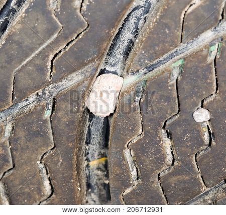 stone in the tire wheel . Photo of abstract background