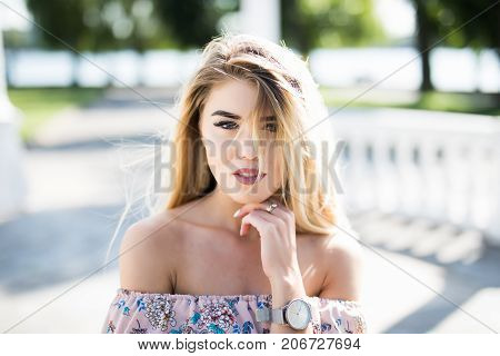 Close-up Portrait Of Young Blonde Womanstanding In The Street. Beautiful Girl In Urban Background.