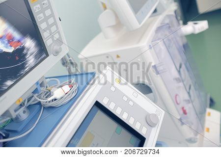 Ultrasonic cardiography unit in hospital ICU room.