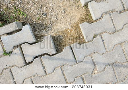 Destroyed Paving of the Sidewalk. The destroyed Laying of Paving Slabs