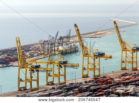 BARCELONA SPAIN - AUGUST 21 2012: Terminal Port Nou ship in import export and business logistic By crane Trade Port Ship cargo to harbor Barcelona. Catalonia Spain.