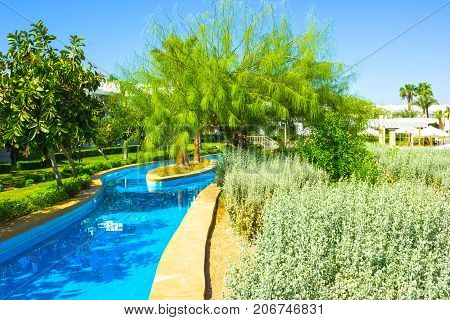 Sharm El Sheikh, Egypt - September 26, 2017: The pool lazy river at Hotel Monter Carlo Sharm Resort and SPA at Sharm El Sheikh, Egypt on September 26, 2017