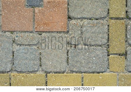 Multicolored Sidewalk Tile Texture. The Texture of Artificial Stone Pavers of Different Colors