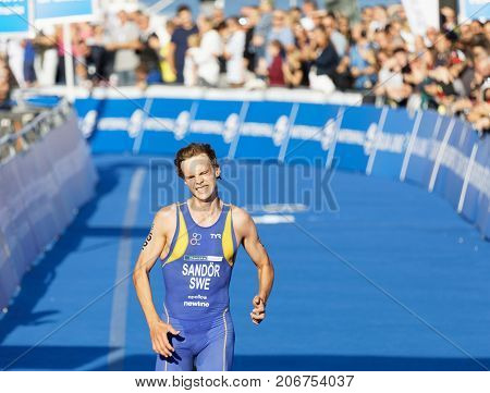 STOCKHOLM - AUG 26 2017: Running triathlete Gabriel Sandor (SWE) close to the finish line in the Men's ITU World Triathlon series event August 26 2017 in Stockholm Sweden