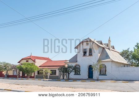 USAKOS NAMIBIA - JULY 3 2017: A street scene with historic houses in Usakos a small town in the Erongo Region of Namibia