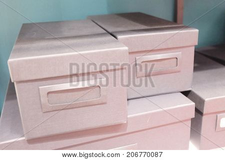 Stack of Office Storage Boxes or Archive Boxes Used for Storing Paper Media and Accessories.